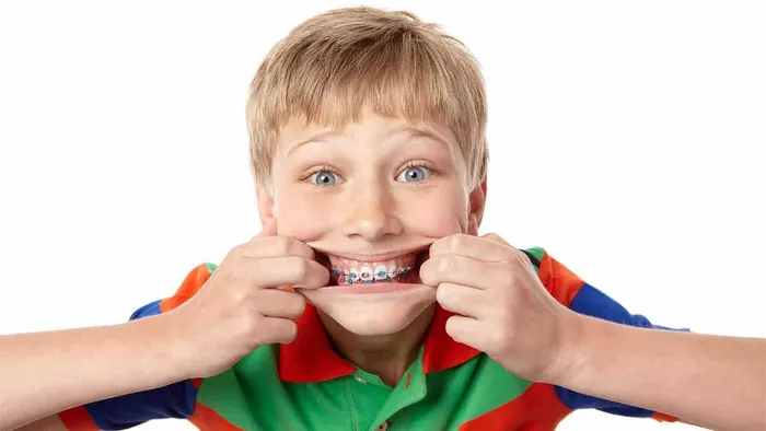 Young woman smiling with metal braces